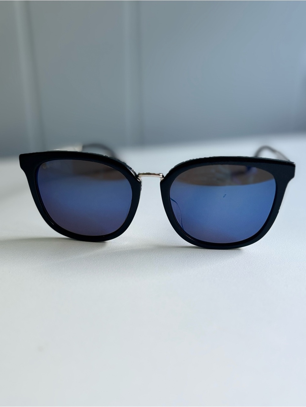 Gucci Women's Black Frame Sunglasses with Blue Mirrored Lenses